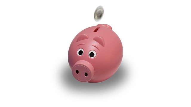 Image of piggy bank with coin on article about saving money on takeaways