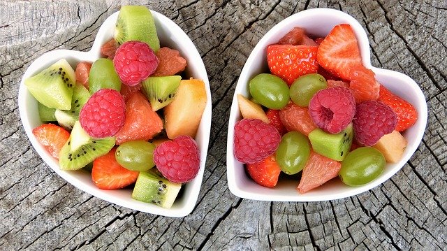 Image of fruit in two heart shaped bowls on article veganuary guide