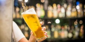 Image of lager being poured on how to stay safe on a night out